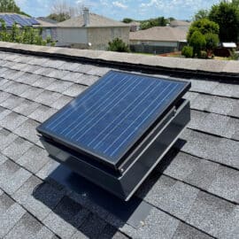 A Remington solar attic fan on a roof.