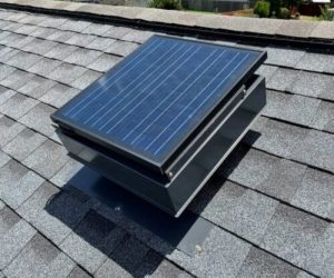 Remington Solar attic fan on a gray, shingled roof.