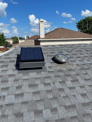 Image of a solar attic fan on a roof.