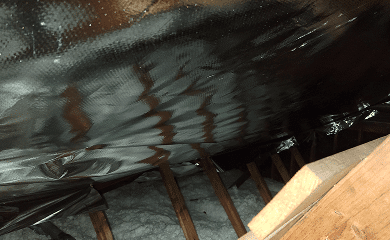 A radiant barrier installed in an attic.