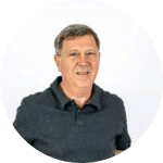 An image of a man in a grey polo shirt.