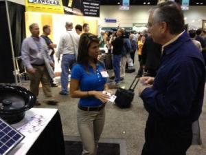 Two people talking at a convention.
