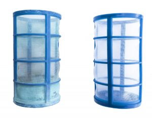 An old Sunshock basket next to one that has been cleaned with Soak and Rinse.